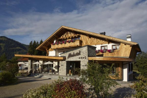 Almhotel Told, Grän, Österreich